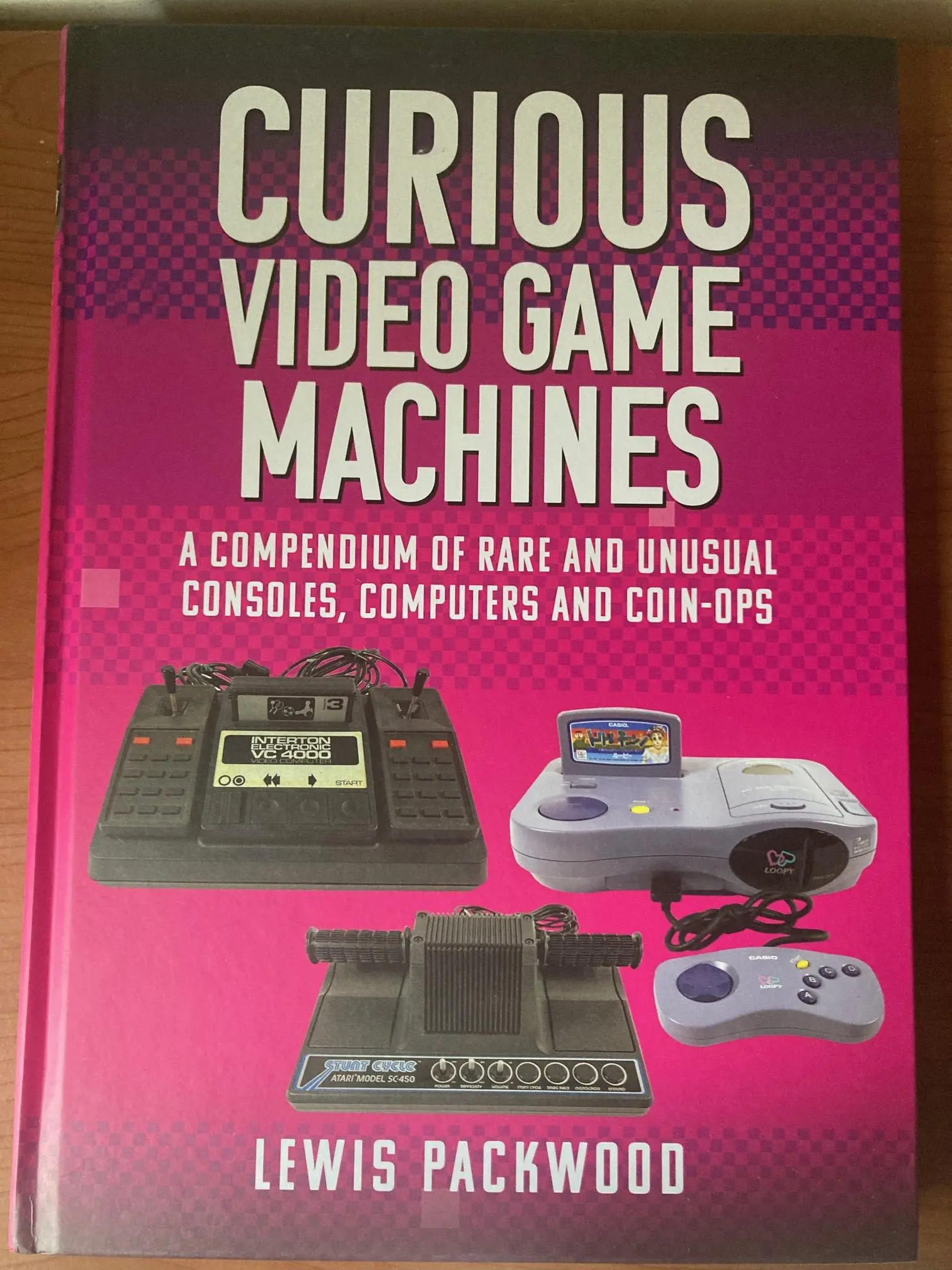 Book titled:

Curious Video game Machines.
A compendium of rare and unusual consoles, computers and coin-ops.

By Lewis Packwood