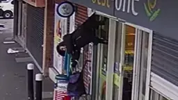 Grandmother left dangling 7ft upside down after getting stuck in shop's shutters