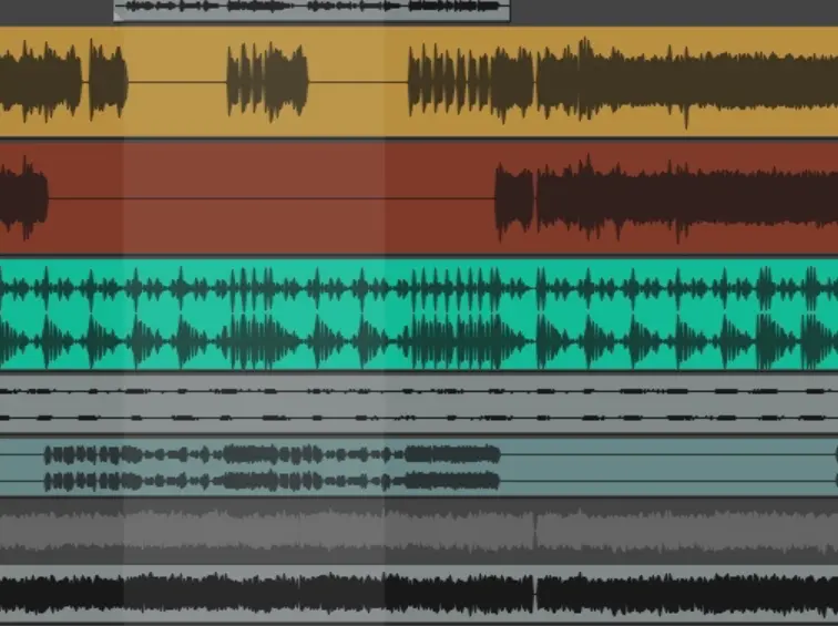 screenshot of a timeline in Reaper digital audio workstation. The rows have different colors and display soundwaves