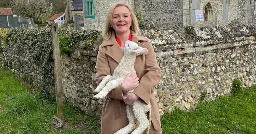 Liz Truss shares bizarre Easter message as she holds uncomfortable-looking lamb