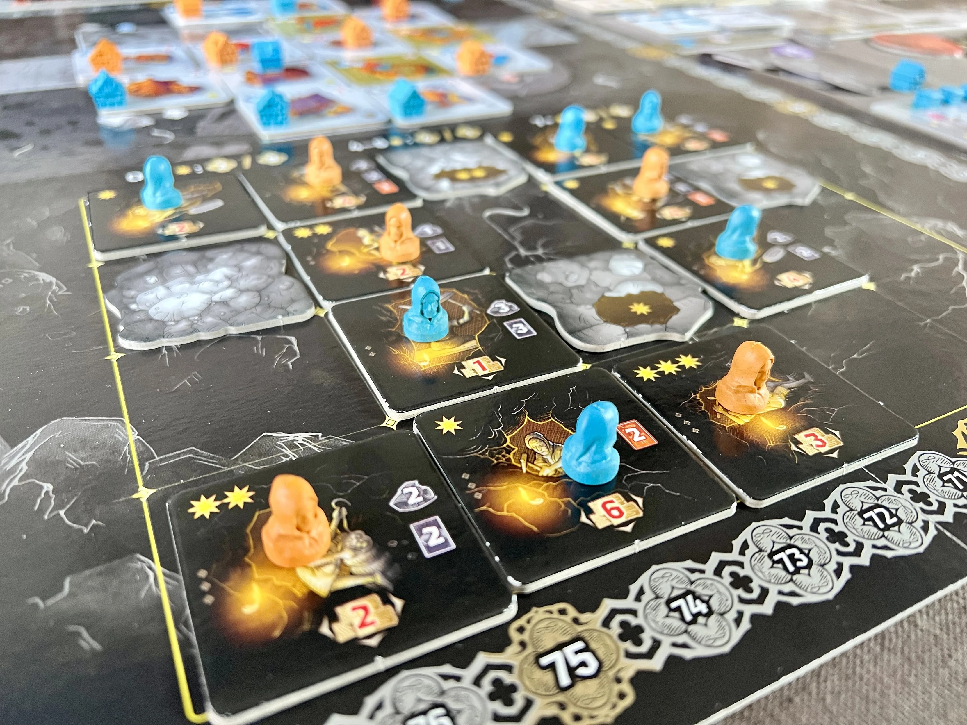 End game board of a two player game of Kutna Hora. Showing the mining section in focus.