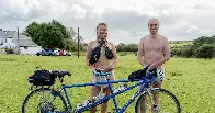 Naked pair turn heads as they complete 260-mile bike ride