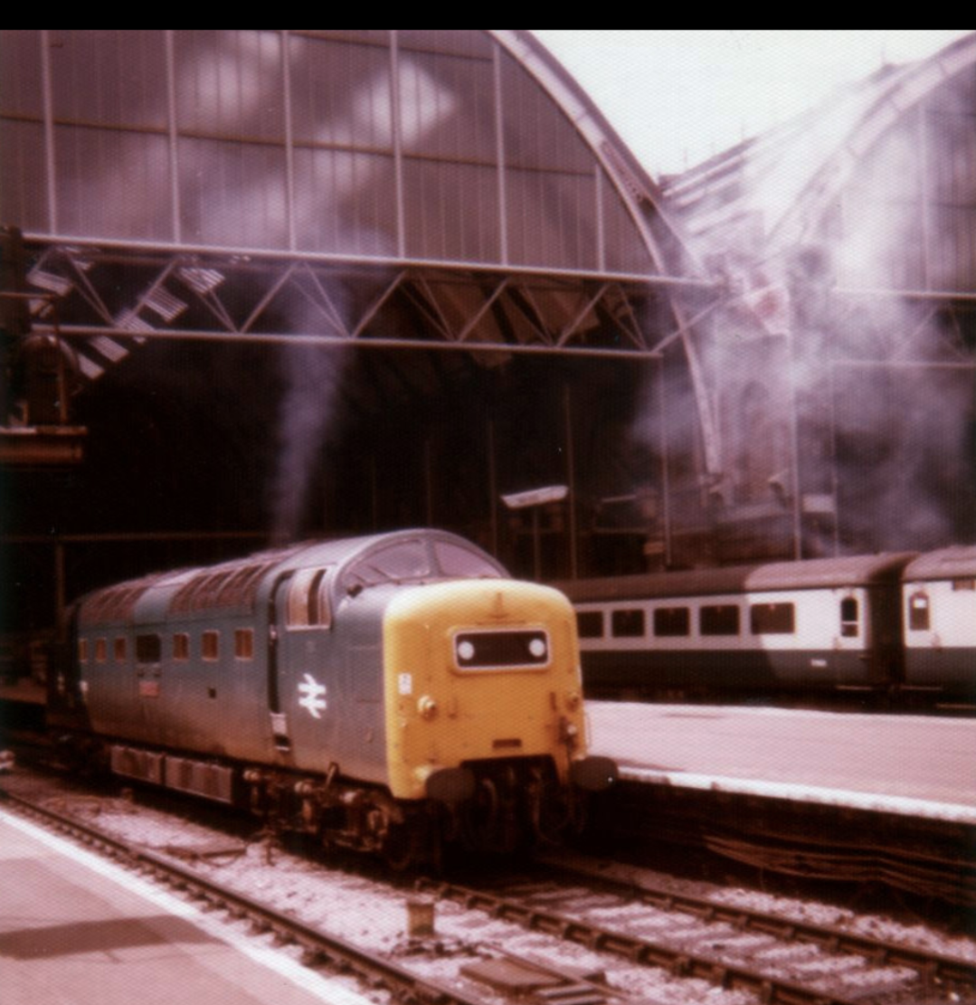 Class 55 Deltic at Kings Cross late 1970s with the front of the train shed behind